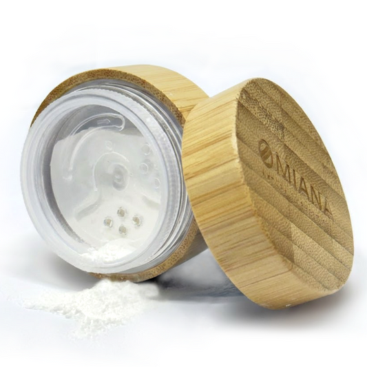 Bamboo container with a titanium dioxide free white mineral veil finishing powder inside on a white background